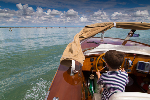 Best Travel Year - Venice, Italy - My six-year-old driving a water taxi in Venice