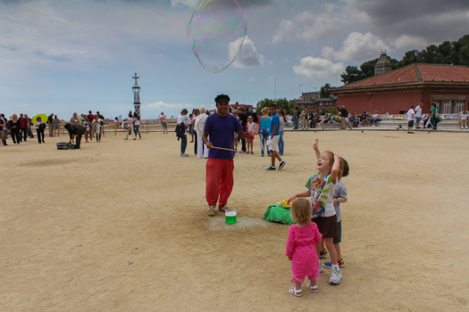 Barcelona, Spain with kids: Playing with street performers in Parc Güell.