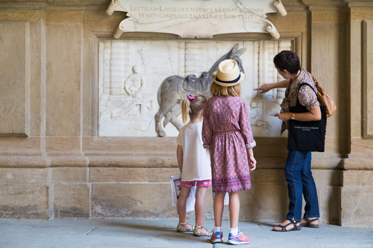Florence with kids - Our guide Elvira (arranged through Concierge in Umbria) showing our kids the art of the Pitti Palace.