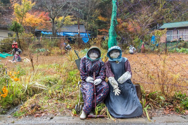 Places to see in Japan - Waiting by the side of the road in Scarecrow Village