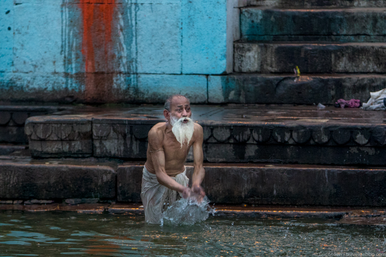 Places to visit in India - A pilgrim bathing in the River Ganges 