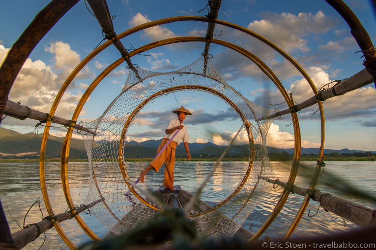 Places to go in Burma: A fisherman on Inle Lake, shot through his net. 