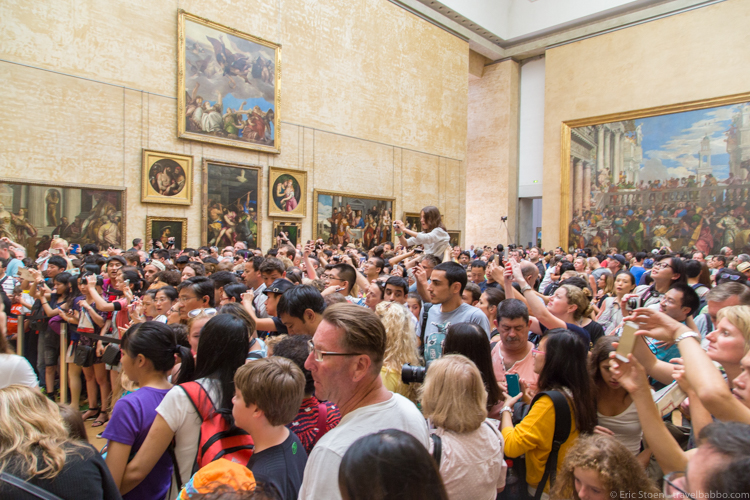 Tips for peak season travel: The Mona Lisa room at the Louvre.