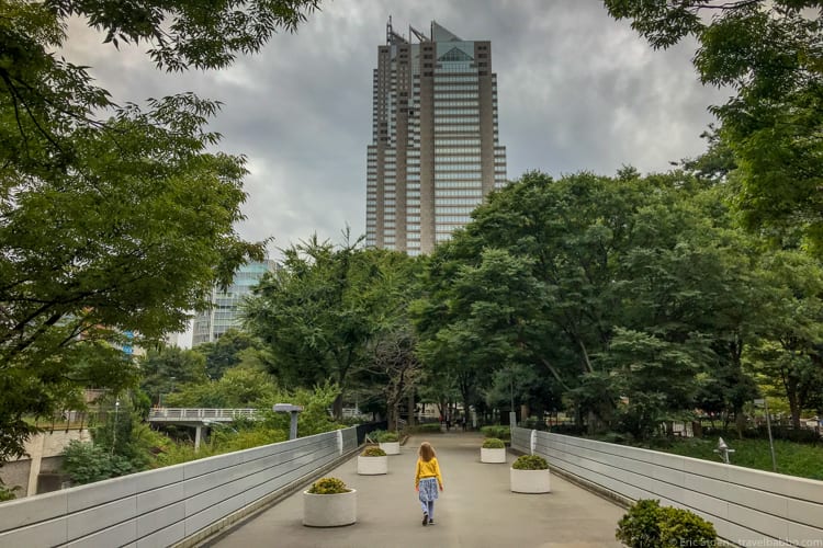 Tokyo with Kids - Walking through Shinjuku Chuo Park, with the Park Hyatt straight ahead