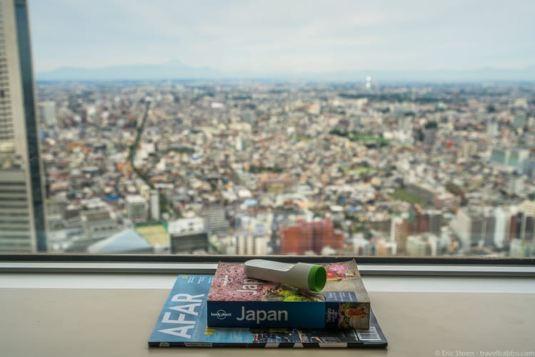 Packing List: Old school travel information, and our thermometer, artfully arranged overlooking Tokyo from the 42nd floor of the Park Hyatt