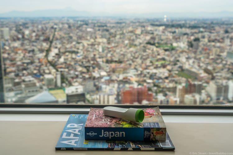 Packing List - Old school travel information, and our thermometer, artfully arranged overlooking Tokyo from the 42nd floor of the Park Hyatt