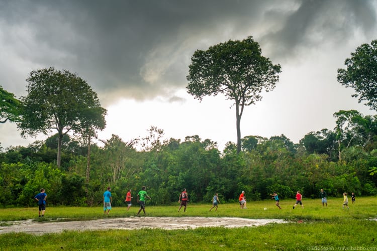 Amazon Rain Forest with Kids - Our kids playing football with the staff from the boat and the local kids