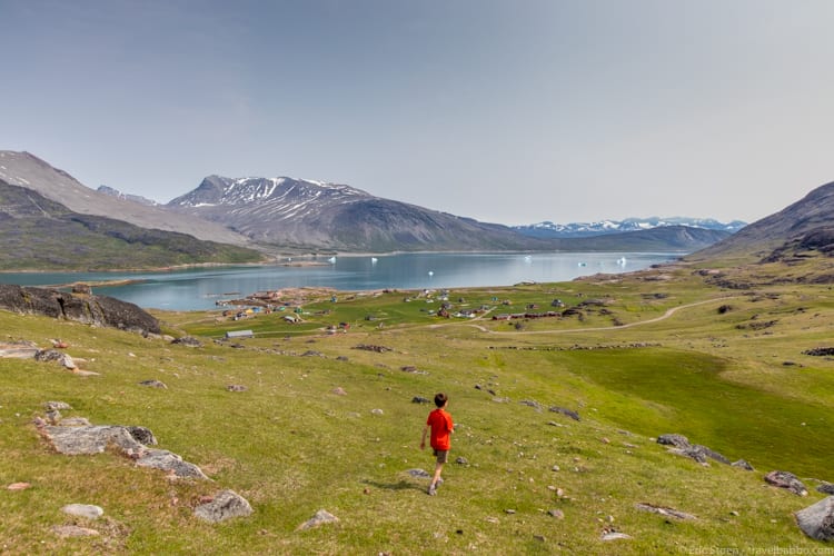 Greenland with kids - Taking a shortcut through a sheep pasture to try to catch the World Cup