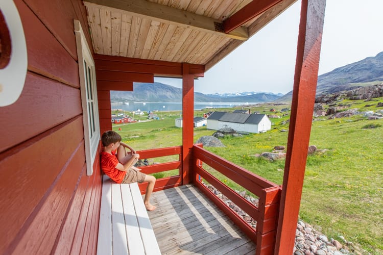 Greenland with kids - Reading at our cabin in Igaliku