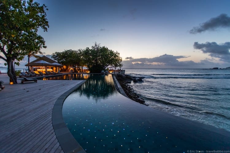 Six Senses Zil Pasyon - The main pool at night, with lights sparkling whenever the water rippled