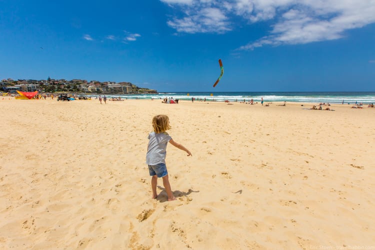 How much does a Disneyland Vacation Cost? Practicing boomerang throwing at Sydney's Bondi Beach