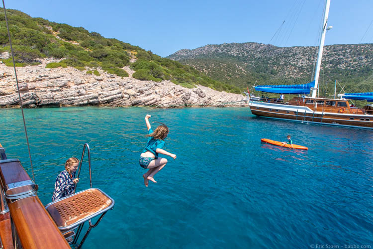 Bodrum - Two kids jumping, one in the kayak