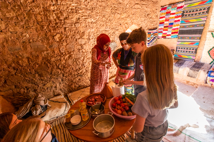 Morocco with Kids - Adding spices to the tagine 