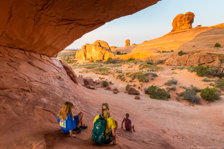 Arches National Park with Kids: Sliding down after passing through Eye of the Whale Arch. With Tava Adventures. 