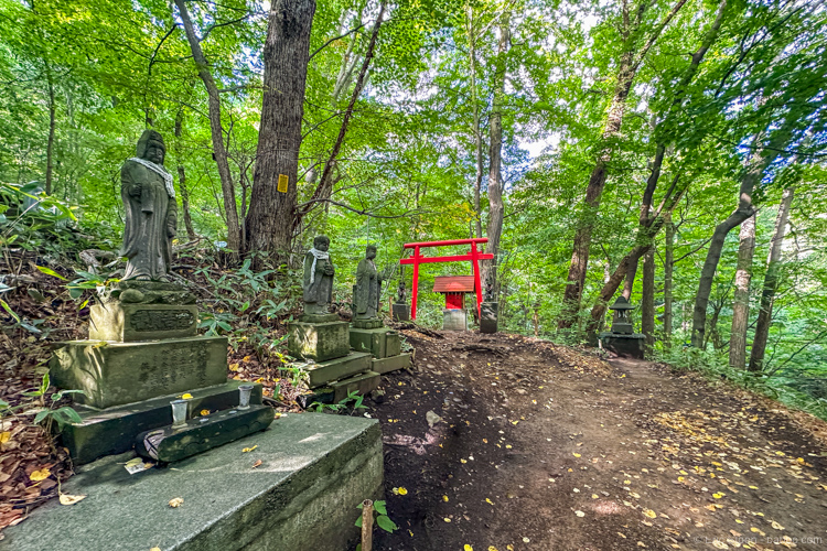 Hokkaido Japan: Hiking down, past shrines and 88 statues of Kannon, the Buddhist Goddess of Mercy